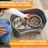 Woman placing The Niner inside the Express Medium to Large Neater Feeder